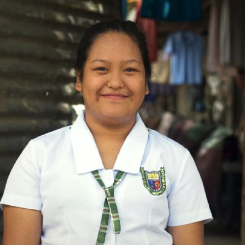 a woman in a white shirt and green tie